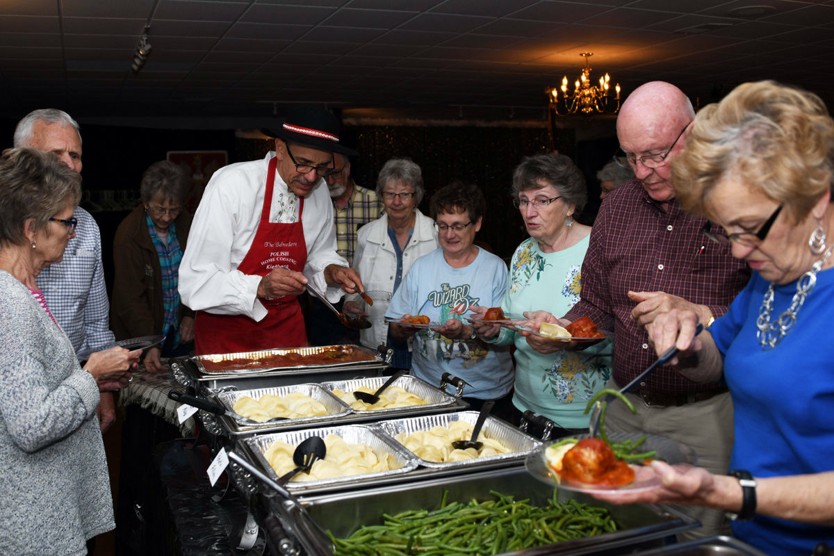 033 The Fun Club travelers were interested in the Polish dumplings called pierogi and other Polish specialties.JPG